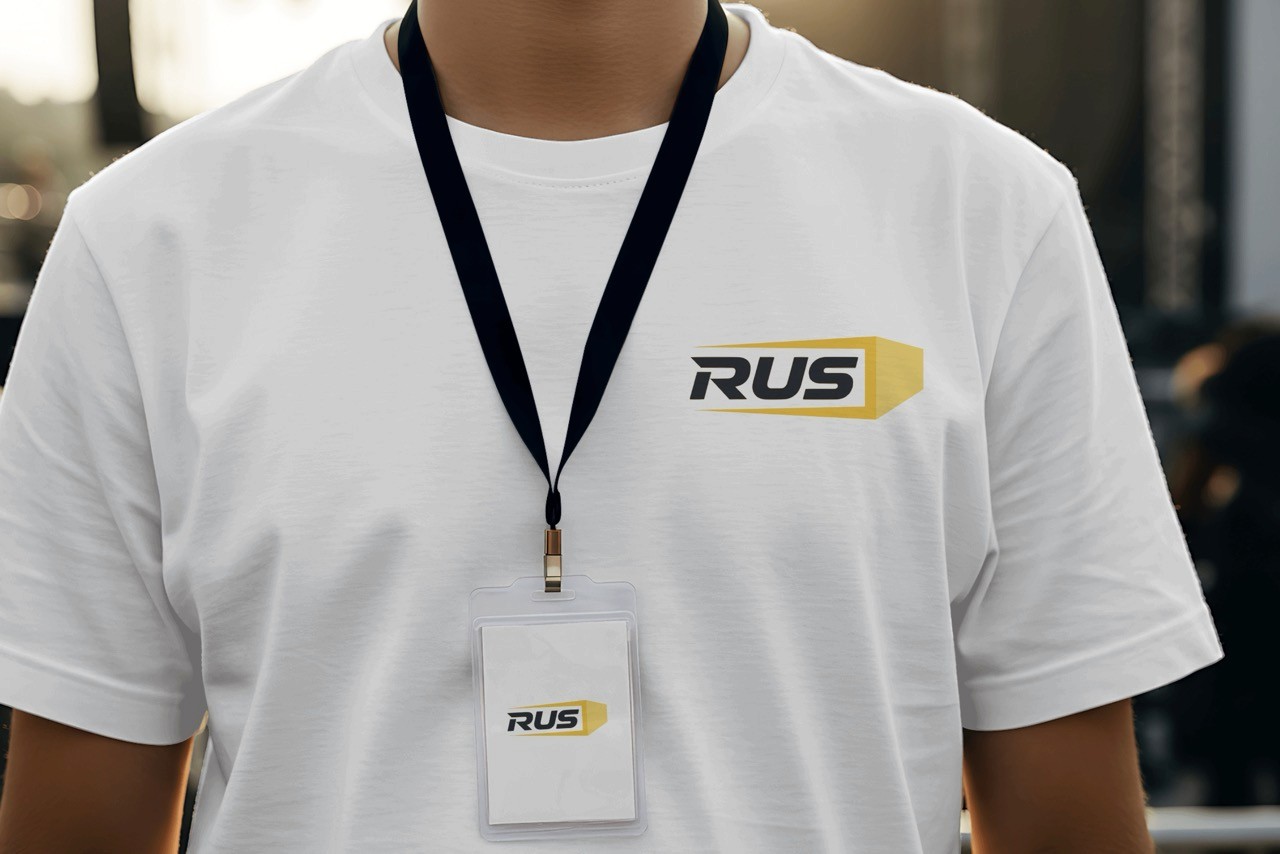 RUS Logistics branded shirt and staff badge close-up
